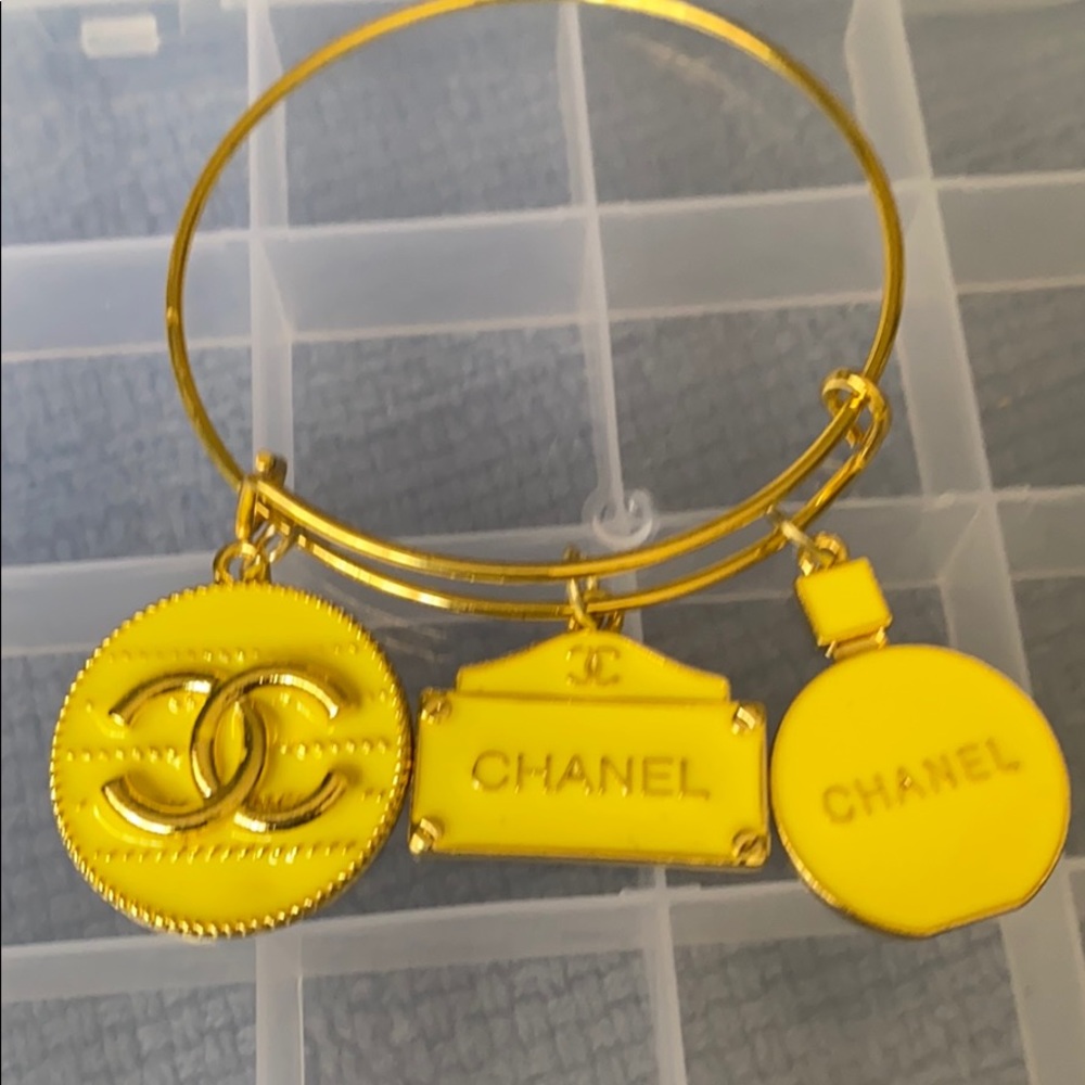 Gold plated bangle with charms